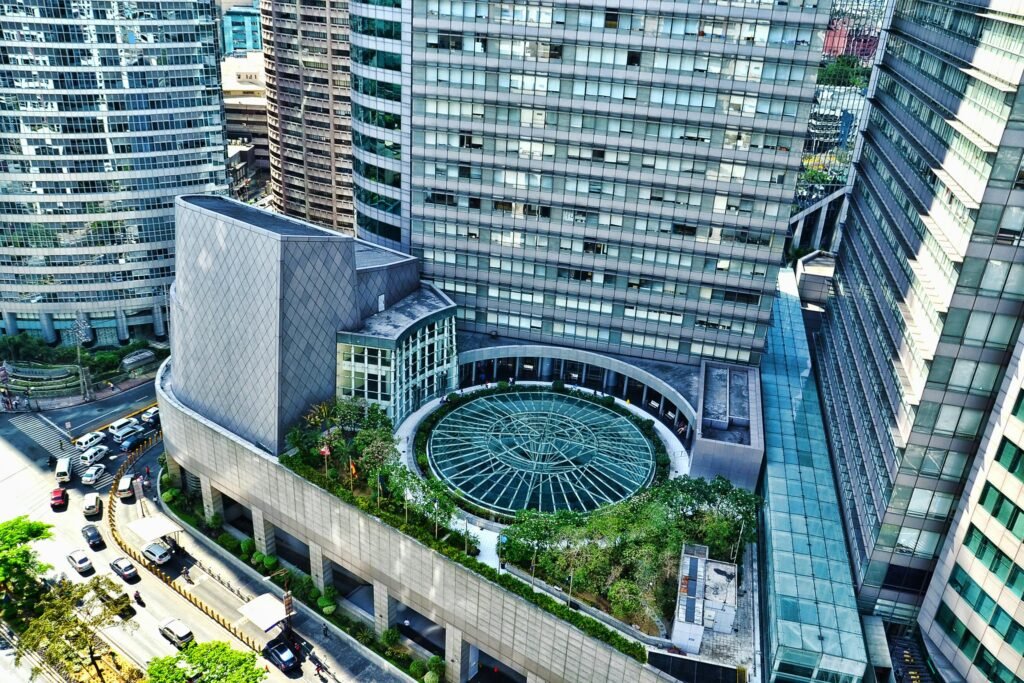 pexels-photo-165248-165248 Aerial shot of modern urban architecture highlighting a circular garden and skyscrapers.